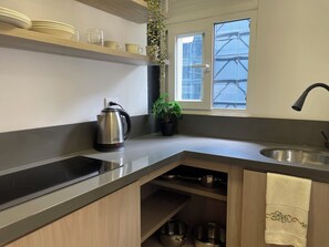 Microwave, stovetop, dishwasher, cookware/dishes/utensils