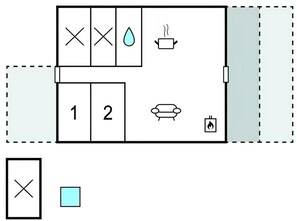 Ein Zimmer mit einer Couch, einem kleinen Tisch, einem Schrank und einer Wandheizung.