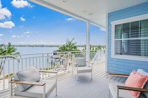 Terrace/patio - Sunrise Serenity on 12th – Waterfront Retreat w/ Heated Pool, Hot Tub, & Balconies (Indian Rocks Beach)
