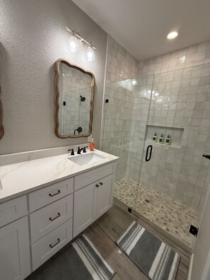 Shower, hair dryer, towels, soap