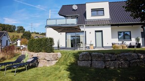 A modern two-story house with a flat roof, large windows, and a balcony. - am Sonnenhang by Interhome (Attendorn)