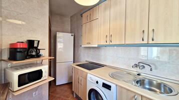 Een koelkast, een magnetron, een broodrooster