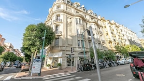 A historic building with a classic architectural style, featuring ornate balconies and a prominent entrance.