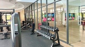 A modern gym with weightlifting equipment and exercise balls. - 1BR 5Min Walk to BeachPool&Gym C243 (Choeng Thale)