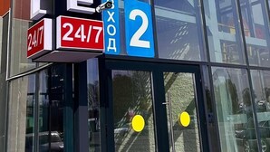 A building with a sign that reads "ELITE HOTEL" and a number "2" indicating the location. The sign also includes a 24/7 availability notice. - Elite Hotel (Almaty)