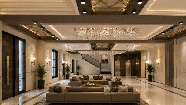 A spacious lobby with a large sectional sofa, a chandelier, and a staircase. - Mangalam Resort and Spa - Member of Absolute Collection   (Gangapur)