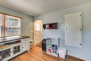 A compact kitchen with a wooden countertop, a white cabinet, and a window with blinds. - Walk to Restaurant & Bar: Home w/ Deck in Gary (Gary)