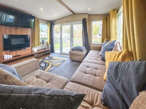 Living area - Spacious caravan sleeps six, with private decking and master ensuite. (Burnham-on-Sea)