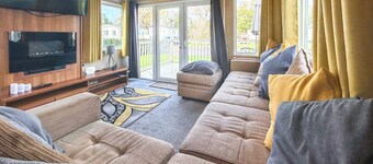 Spacious caravan sleeps six, with private decking and master ensuite.