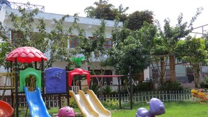 A playground with slides and climbing structures. - Serene Retreat Phu Quoc (Phu Quoc)