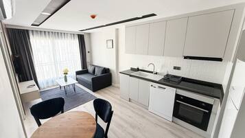 Superior Apartment, Kitchen | Living area | 43-inch LED TV with satellite channels, Netflix, streaming services