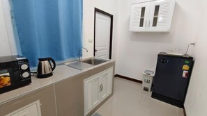 Fridge, cleaning supplies, paper towels