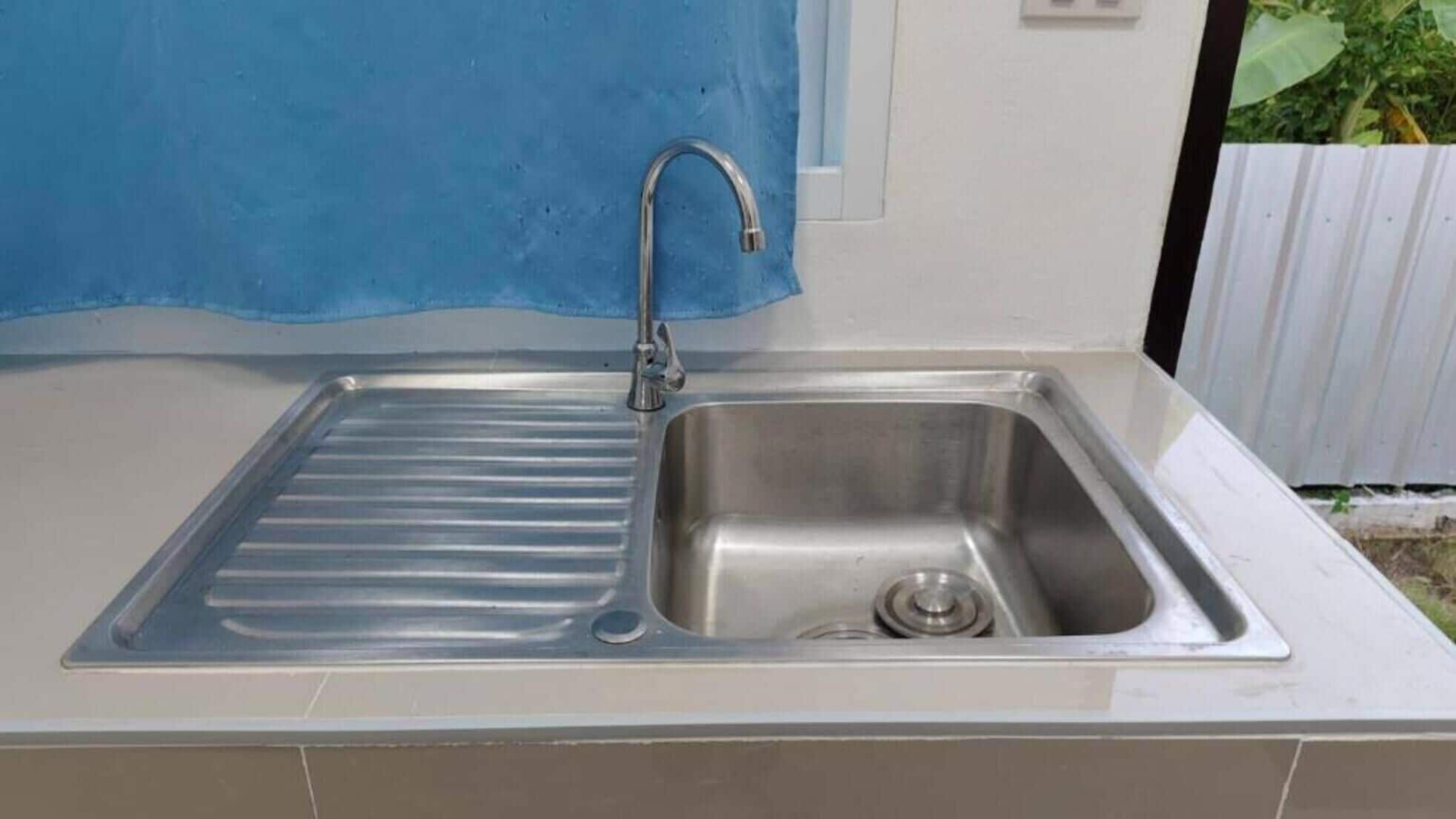 Fridge, cleaning supplies, paper towels