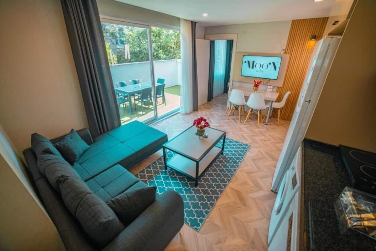 Grand Apartment, 3 Bedrooms, Patio | Living area | 43-inch Smart TV with satellite channels, Netflix, streaming services