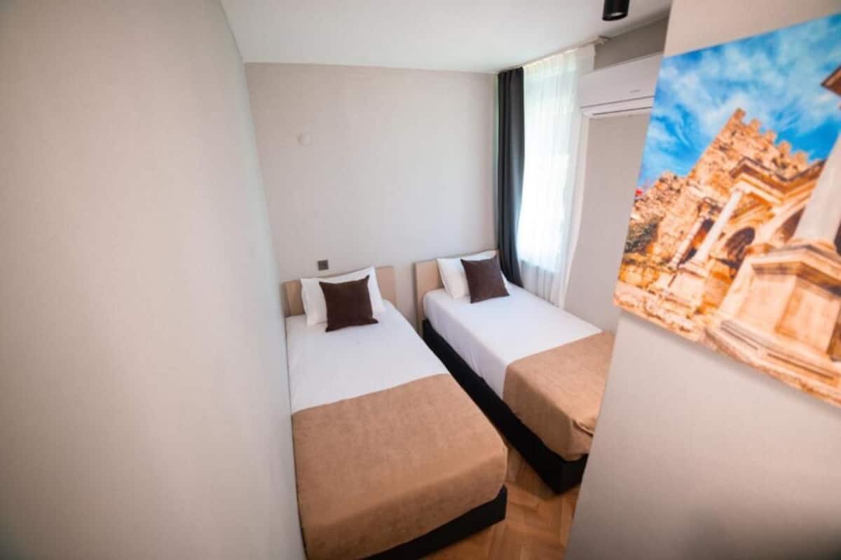 Deluxe Apartment, 2 Bedrooms | Premium bedding, desk, laptop workspace, blackout drapes