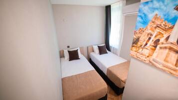 Deluxe Apartment, 2 Bedrooms | Premium bedding, desk, laptop workspace, blackout drapes