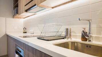 Fridge, microwave, stovetop, coffee/tea maker