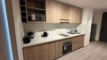Fridge, microwave, stovetop, coffee/tea maker