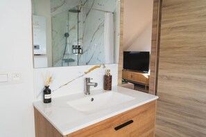 Shower, hair dryer, towels, soap