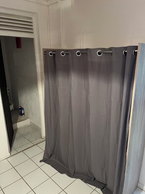 Shower, hair dryer, towels, toilet paper