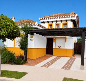 A two-story building with a tiled roof, a covered entrance, and a number '59' on the wall. - Villa Alegre, Mar Menor Golf (Torre-Pacheco)