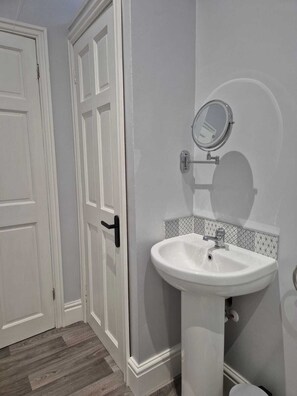 Shower, hair dryer, towels, toilet paper