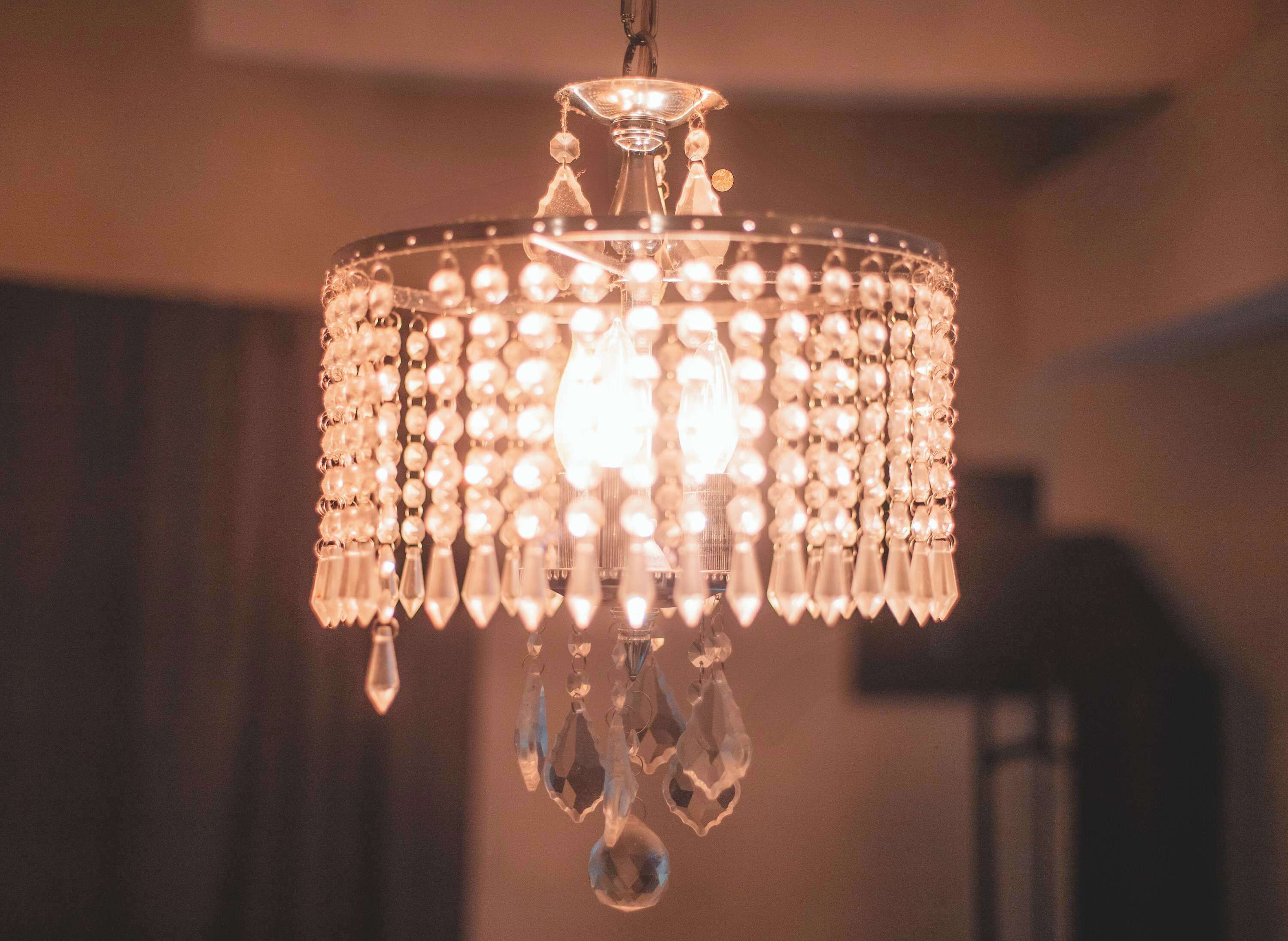A chandelier with multiple crystal elements and a central light fixture.