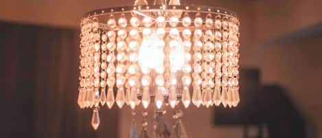 A chandelier with multiple crystal elements and a central light fixture.