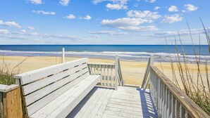 A wooden boardwalk leading to a beach with a clear view of the ocean. - SS3 - Oceanfront 6 bedroom, 5 bath, dune top deck w/ hot tub, billiards table (Southern Shores)