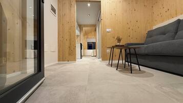 Cabaña Deluxe, balcón, vista al mar | Área de sala de estar