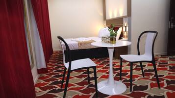 Standard Quadruple Room, City View | Desk, laptop workspace, soundproofing, iron/ironing board