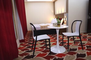 Standard Quadruple Room, City View | Desk, laptop workspace, soundproofing, iron/ironing board - Tanha Park Hotel (Dubai)