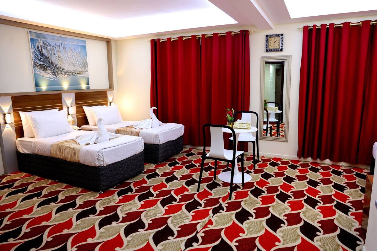 Standard Quadruple Room, City View | Desk, laptop workspace, soundproofing, iron/ironing board (on request)