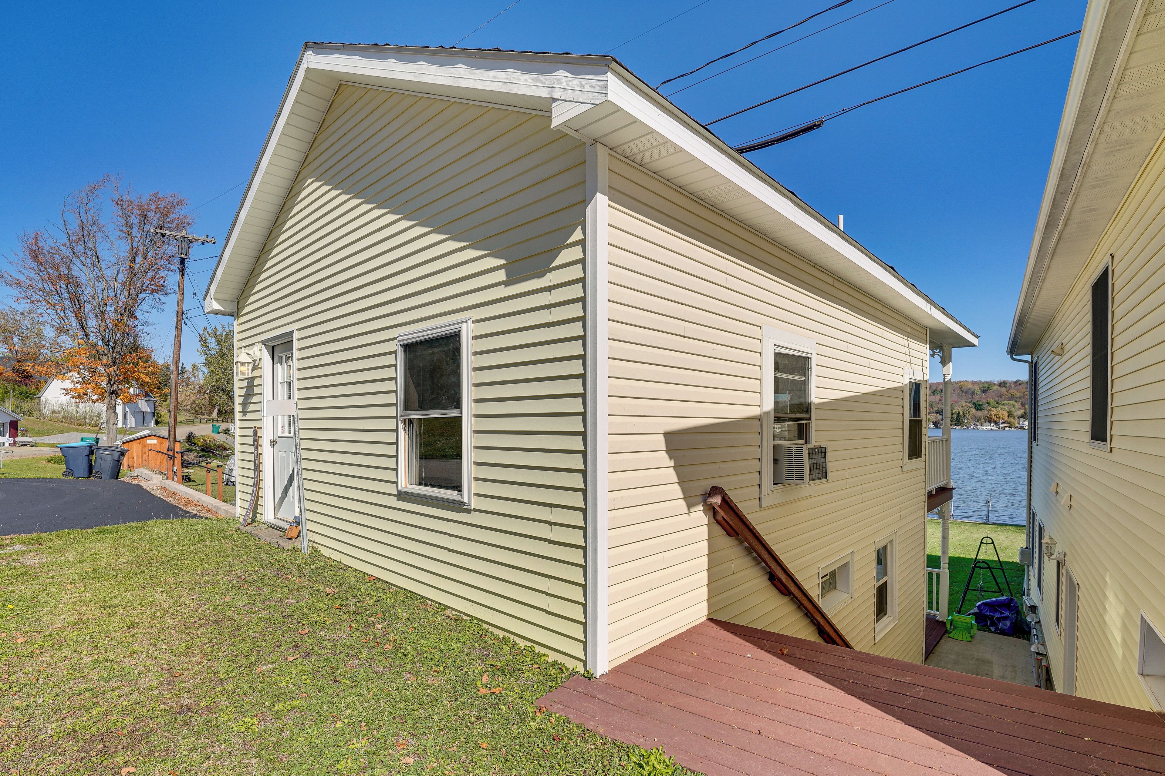 A single-story house with a front porch and a small deck.