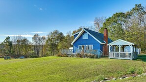 A blue house with a porch and a small gazebo. - Relaxation Meets Upstate Adventure at Salem Home! (Salem)