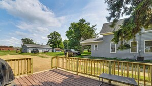 A wooden deck with a bench and grill, surrounded by a fenced yard with a gravel path. - Walk to Restaurant & Bar: Home w/ Deck in Gary (Gary)