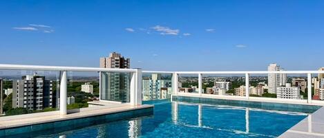 Outdoor pool, open 7:00 AM to 10:00 PM, pool loungers