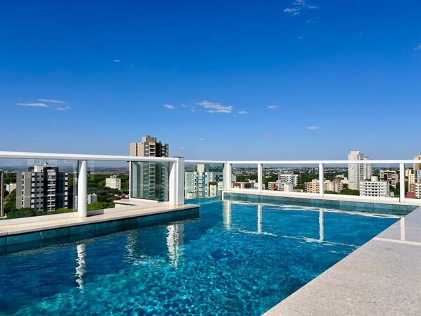 Outdoor pool, open 7:00 AM to 10:00 PM, sun loungers