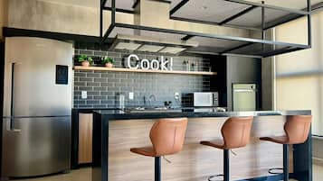 Fridge, microwave, stovetop, cookware/dishes/utensils