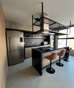 Fridge, microwave, stovetop, cookware/dishes/utensils