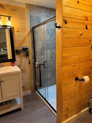 Shower, hair dryer, towels, toilet paper