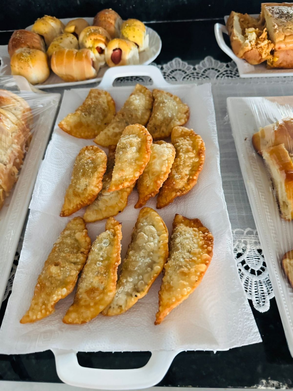 A tray of fried pastries on a table.