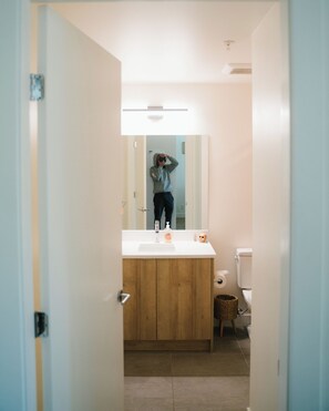 Shower, toilet paper - Bright 2-Bedroom Condo in Railyards, Vic West—Steps from Goose Trail & Downtown (Victoria)