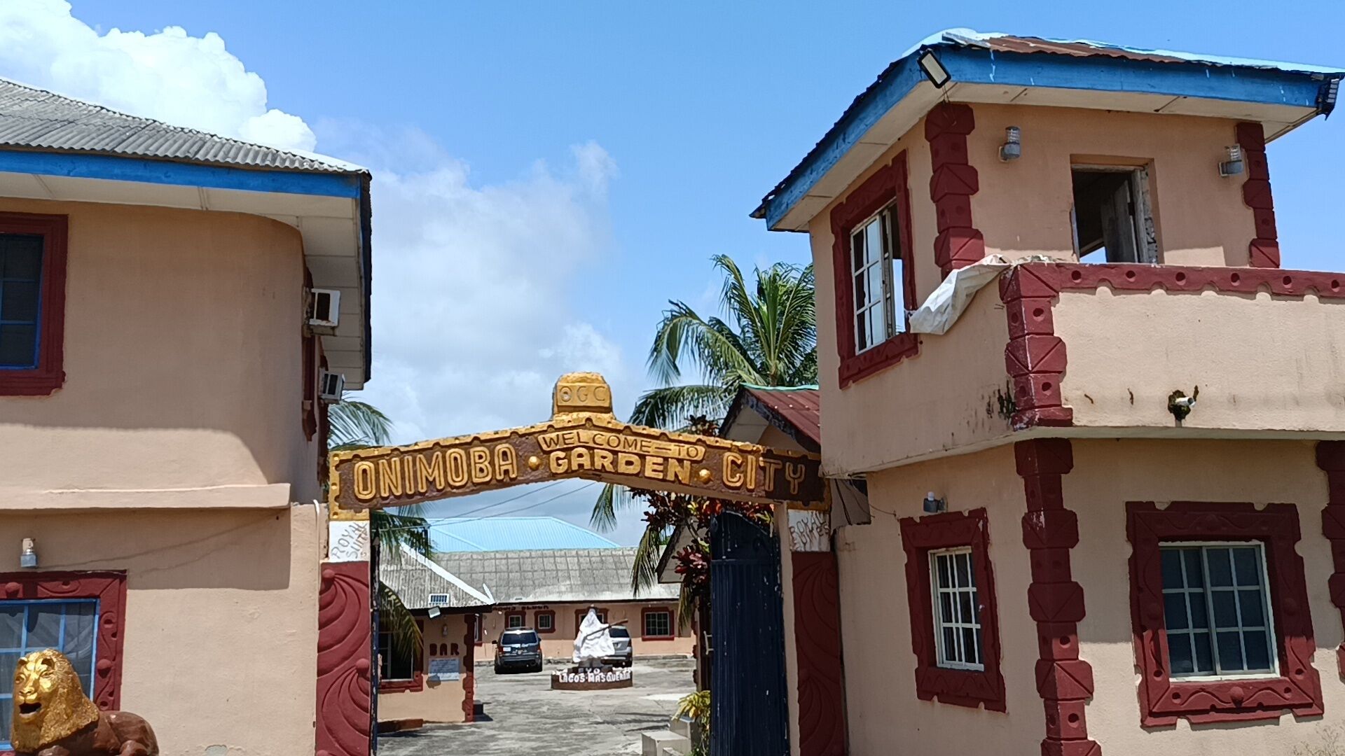 A sign welcoming visitors to Onimoba Garden City.