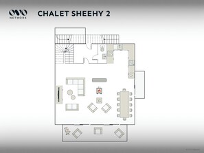 A floor plan of Chalet Sheehy 2, featuring a living area with a sofa and TV, a dining area with a table and chairs, a kitchen with a stove and sink, and a small balcony. - Chalet Sheehy - Modern property with spa and terraces - OVO Network (La Toussuire)