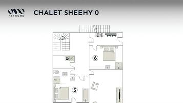 Grundrids af et hotelværelse med navnet 'CHALET SHEEHY 0', der inkluderer et badeværelse, et soveværelse, en opholdsstue og et tekøkken.