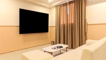 Family Room | Desk, laptop workspace, blackout drapes, soundproofing