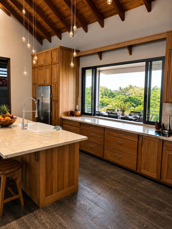 A kitchen with wooden cabinets, a stainless steel refrigerator, a large island with a sink, and pendant lighting.