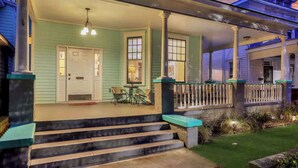 A two-story house with a porch, steps leading to the entrance, and a number '524' above the door. - Historic Downtown Victorian Home Near Forsyth (Savannah)