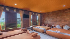 A room with two beds, a TV, and large windows with curtains. - Jawa Dwipa Villa (Wonosobo)